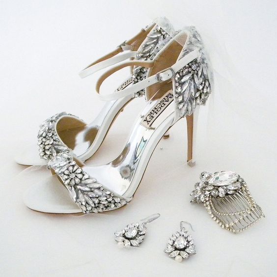 Can we ever get enough sparkle? The Badgley Mischka Tampa wedding sandal is an instagram #shoegasm and our Cheryl King Earrings and Erin Cole Bridal Comb couldn't complement these heels more perfectly.