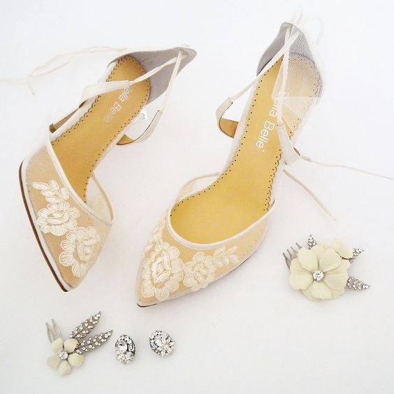 Romantic. Ethereal. All your bridal accessories in one place. Lace wedding shoes by Bella Belle, floral hair combs by Debra Moreland of Paris and stunning crystal stud earrings designed by Cheryl King Couture.