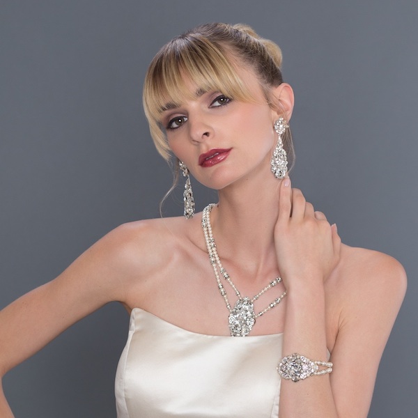 Our model is wearing Cheryl King Couture chandelier earrings SW599E, necklace SW537N and bracelet SW470B