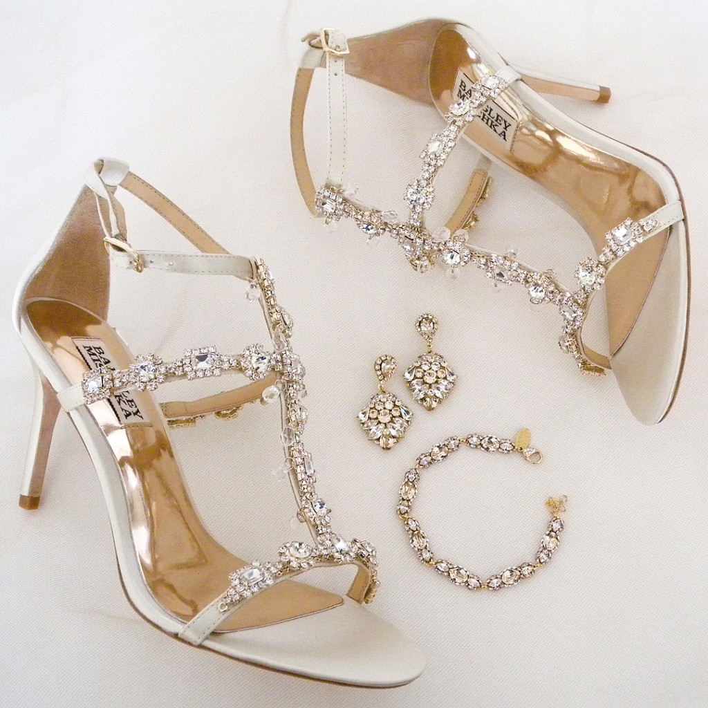 Cascade ~ a strappy, sexy ivory bridal sandal with major bling set in gold. How "fab" does our Haute Bride jewelry look with these wedding shoes?